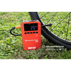 Accubooster met luchtcompressor